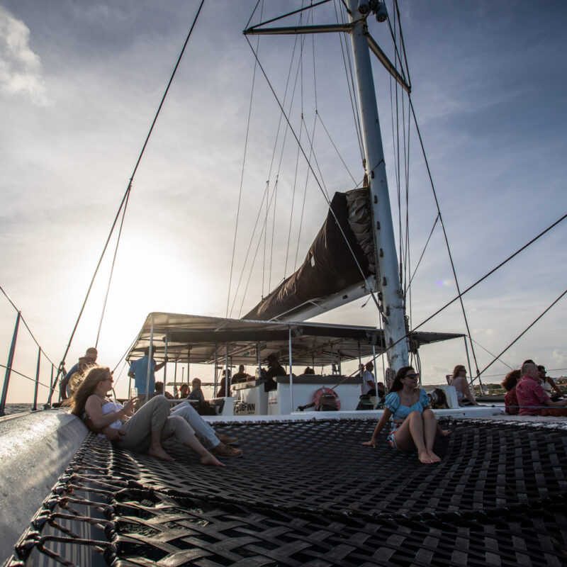 People enjoying the sunset on the deck