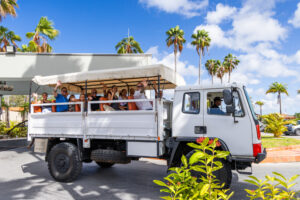 People in back on jeep snorkeling trip