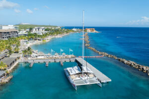 red dragon sailing boat by the shore