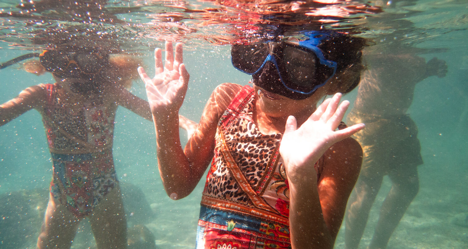 kid snorkeling at playa piskado